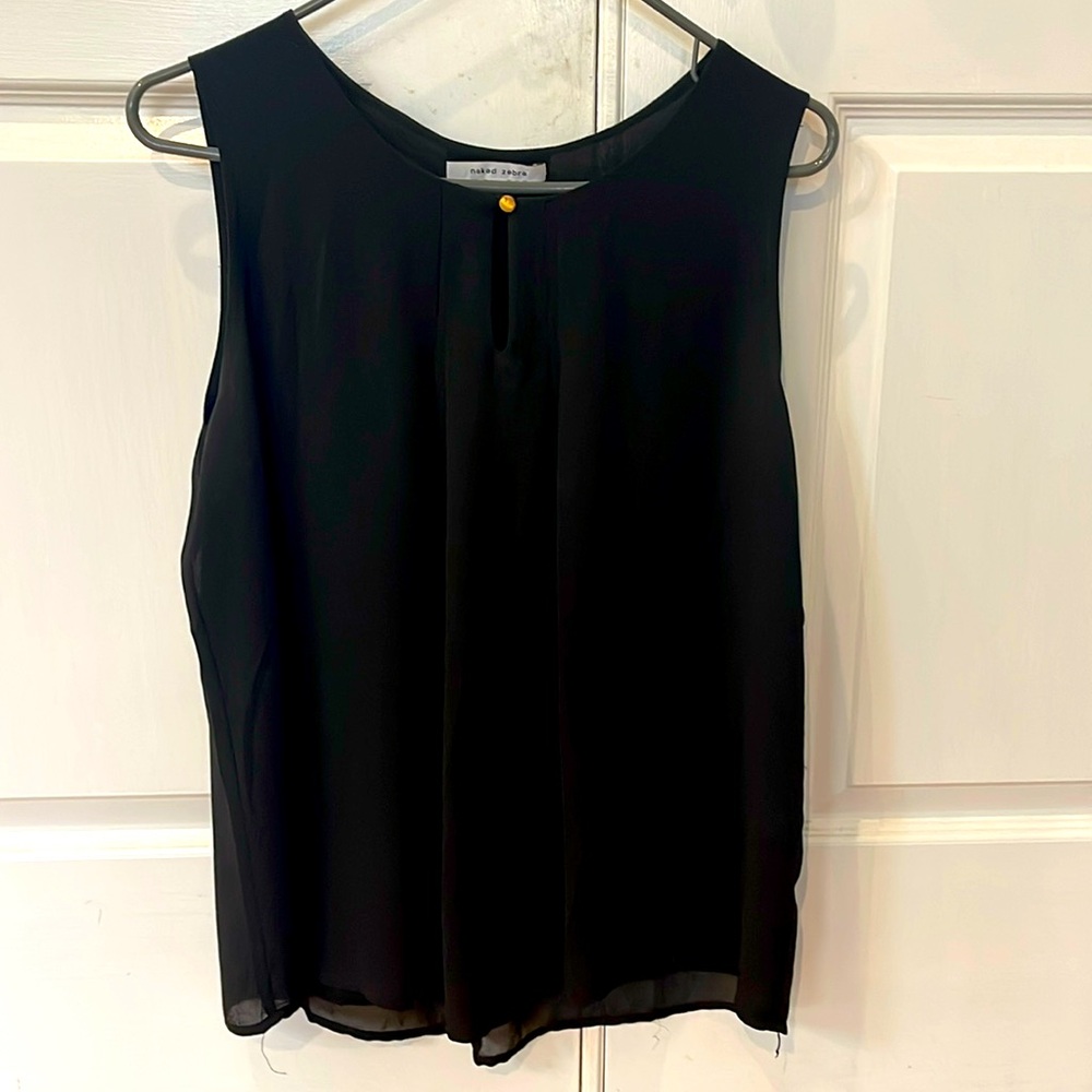 Black sleeveless blouse. Loose, pleated front with keyhole detail.